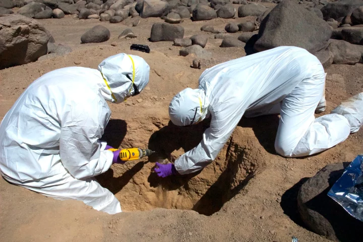 Researchers collect samples from the surface of the Atacama Desert in Chile, going a few centimeters into the ground