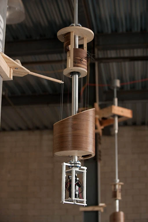 This innovative musical instrument features four robotic pendulums, each housing an eleven string harp (image from Pattern Studio)