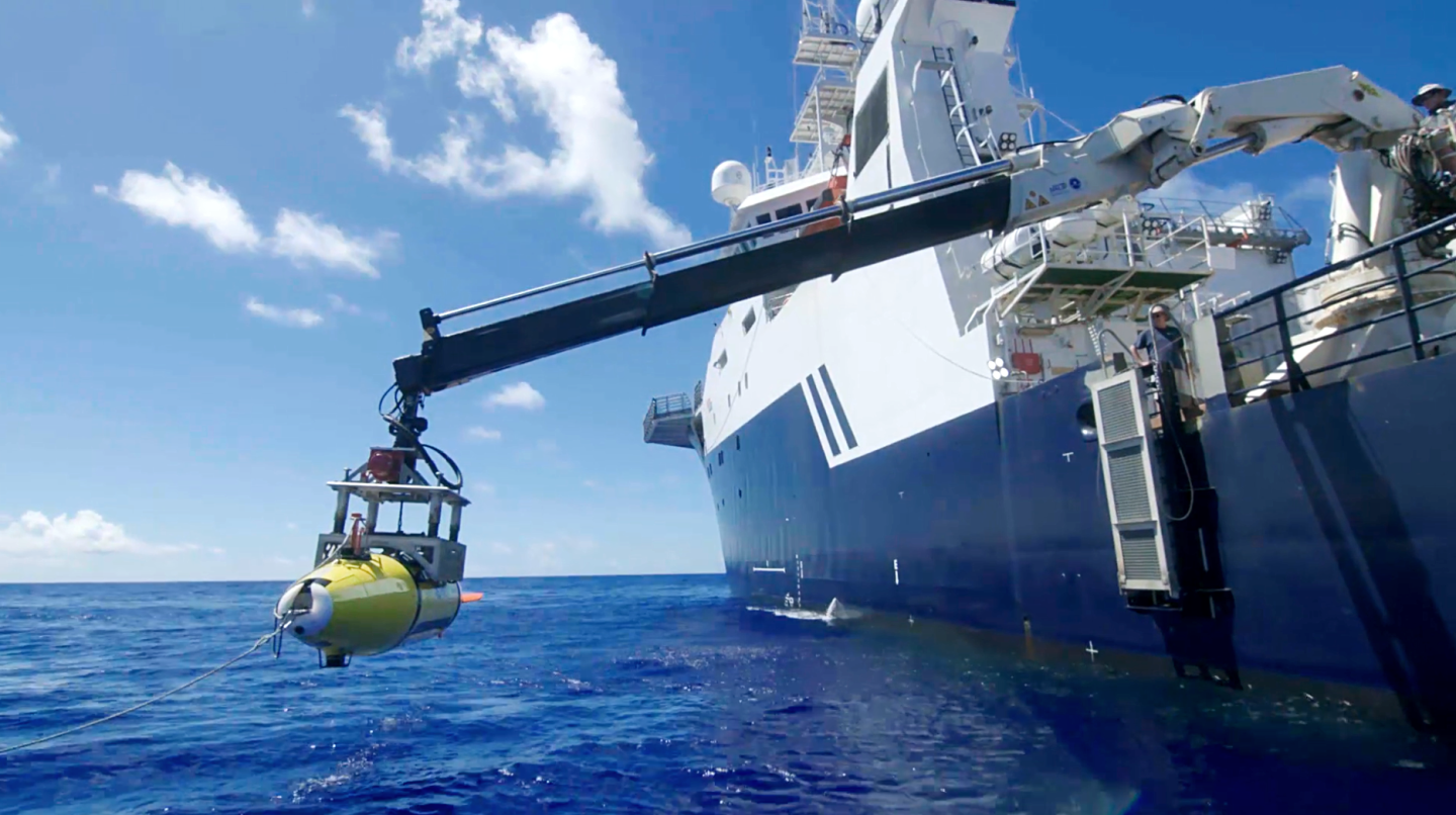 The AUV is lowered into the Philippine Sea in search of the USS Indianapolis