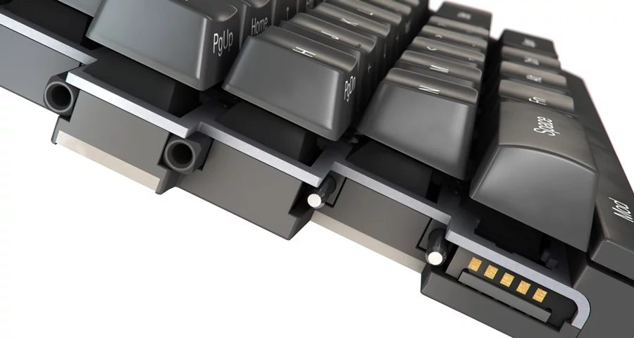 Magnets and steel guides are used to slot the two pieces of the keyboard together