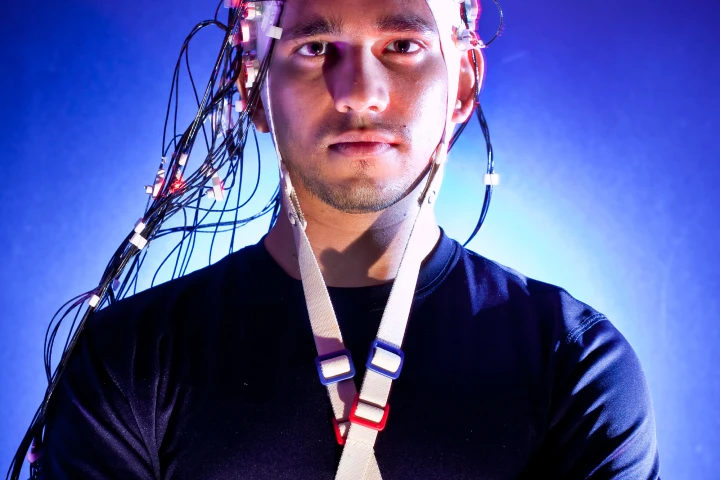 Harsha Agashe, a Ph.D. student in Contreras-Vidal's lab at UMD wears the Brain Cap, a non-invasive, sensor-lined cap (Image: John Consoli, University of Maryland)