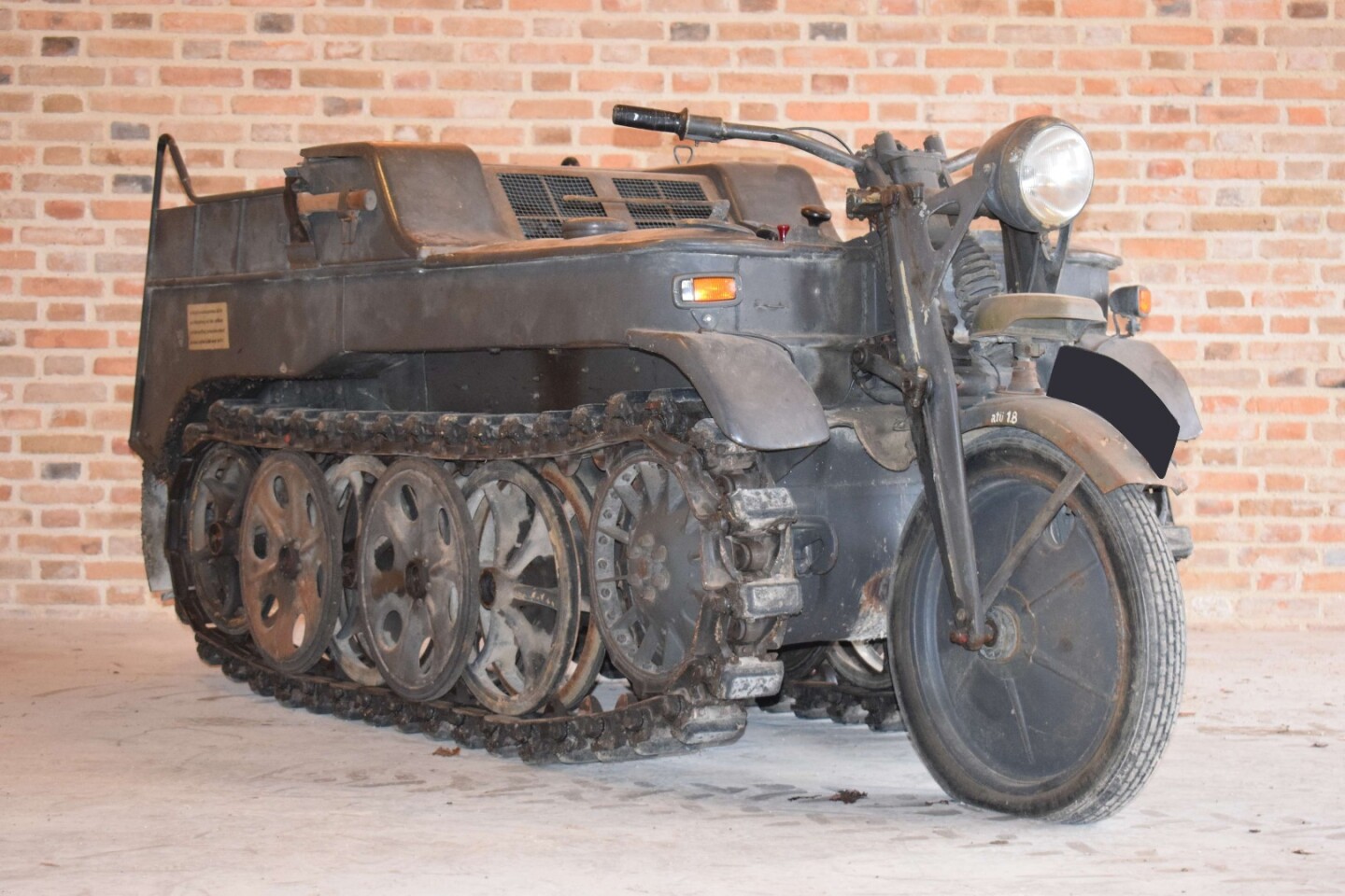 NSU's part-motorcycle, part-tank Kettenkrad was initially built for German airborne troops in WW2 but with its 1,478 cc 4-cylinder Opel engine and all that traction, it quickly found usage in any difficult terrain, gaining a fine reputation as an all-purpose tractor, and it was manufactured until 1948 in post-war Europe due to its versatility. This Kettenkrad sold for $84,709 (€69,136)