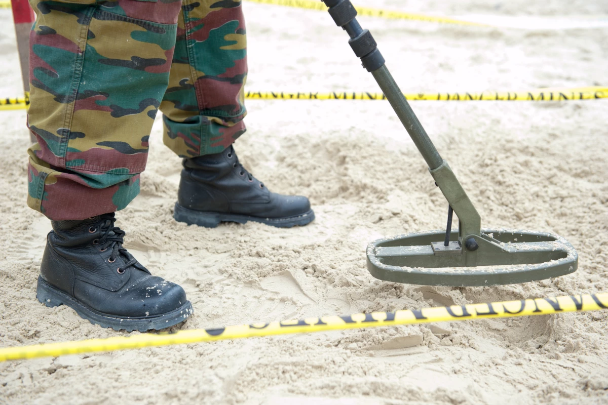 Conventional landmine-detection technologies (pictured) often identify other buried objects as mines
