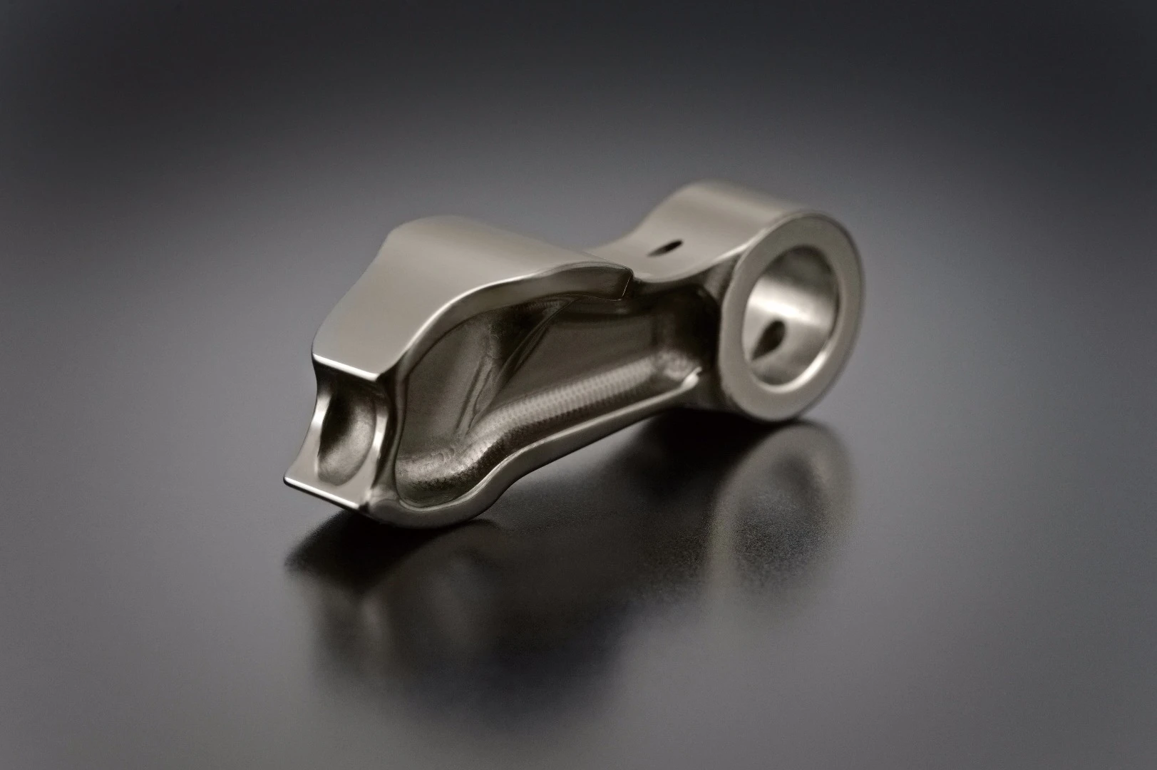 This is a finger follower arm in replacement of bucket tappets in the valvetrain of the new Suzuki GSX-R1000/R