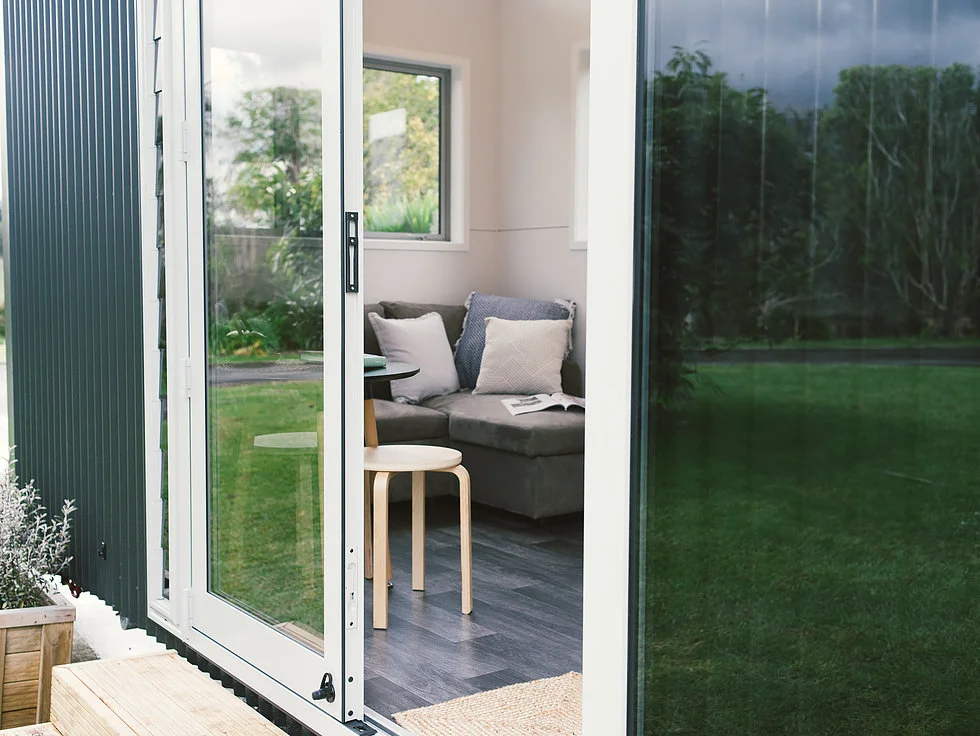 The Buster Tiny House is accessed by large double doors