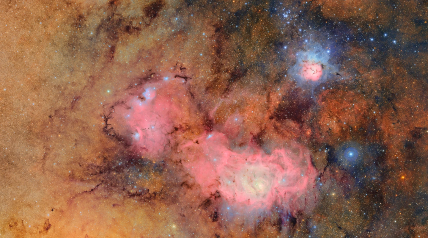 A composite image of the Trifid Nebula (top) and the Lagoon Nebula courtesy of the LSST camera at the heart of the Simonyi Survey Telescope of the NSF-DOE Vera C. Rubin Observatory in Chile