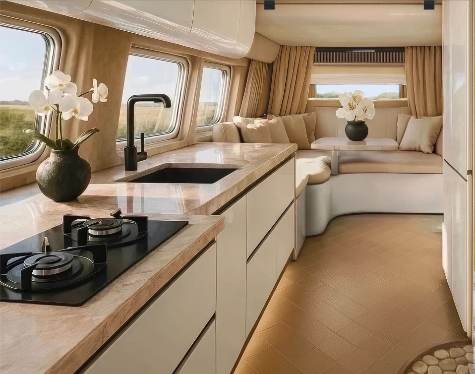 By partitioning off the living area with a wall and curtains, widening the aisle, and using warm, earthy materials and colors throughout, Robeta creates a space that feels less like a conventional camper van, more like an inviting mini-home