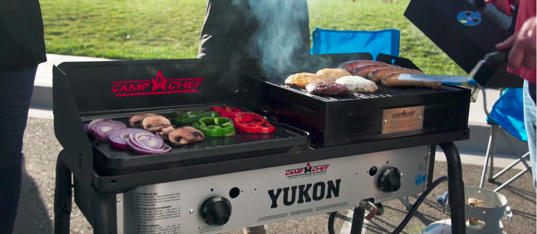 Shown here with the Reversible Grill/Griddle and the standard BBQ Grill Box (we used the Deluxe version with more convenient hinged lid), the Camp Chef Yukon cooks up a full meal like other camping stoves only wish they could