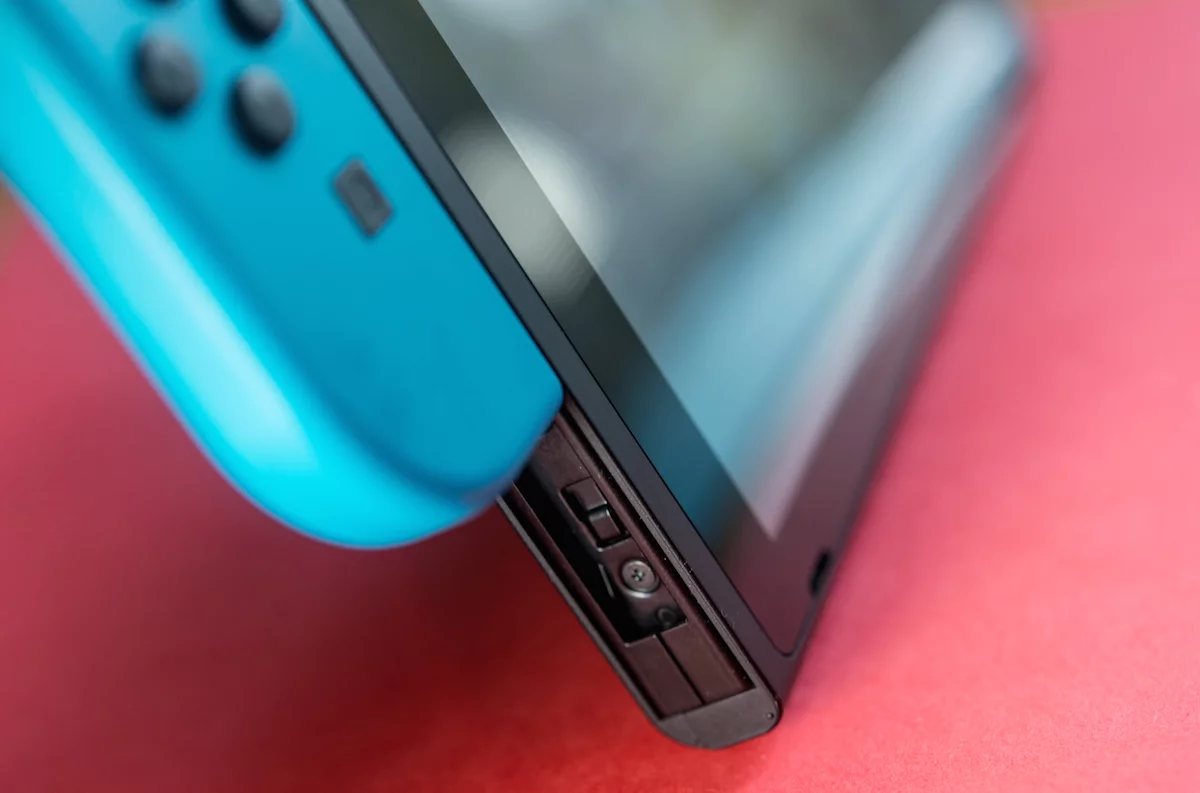 The two Joy-Cons slide onto the sides of the Nintendo Switch console for handheld mode