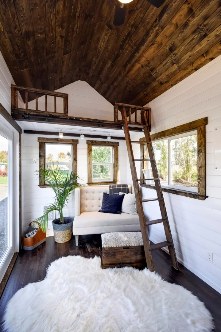 The second loft space is accessible via a timber ladder