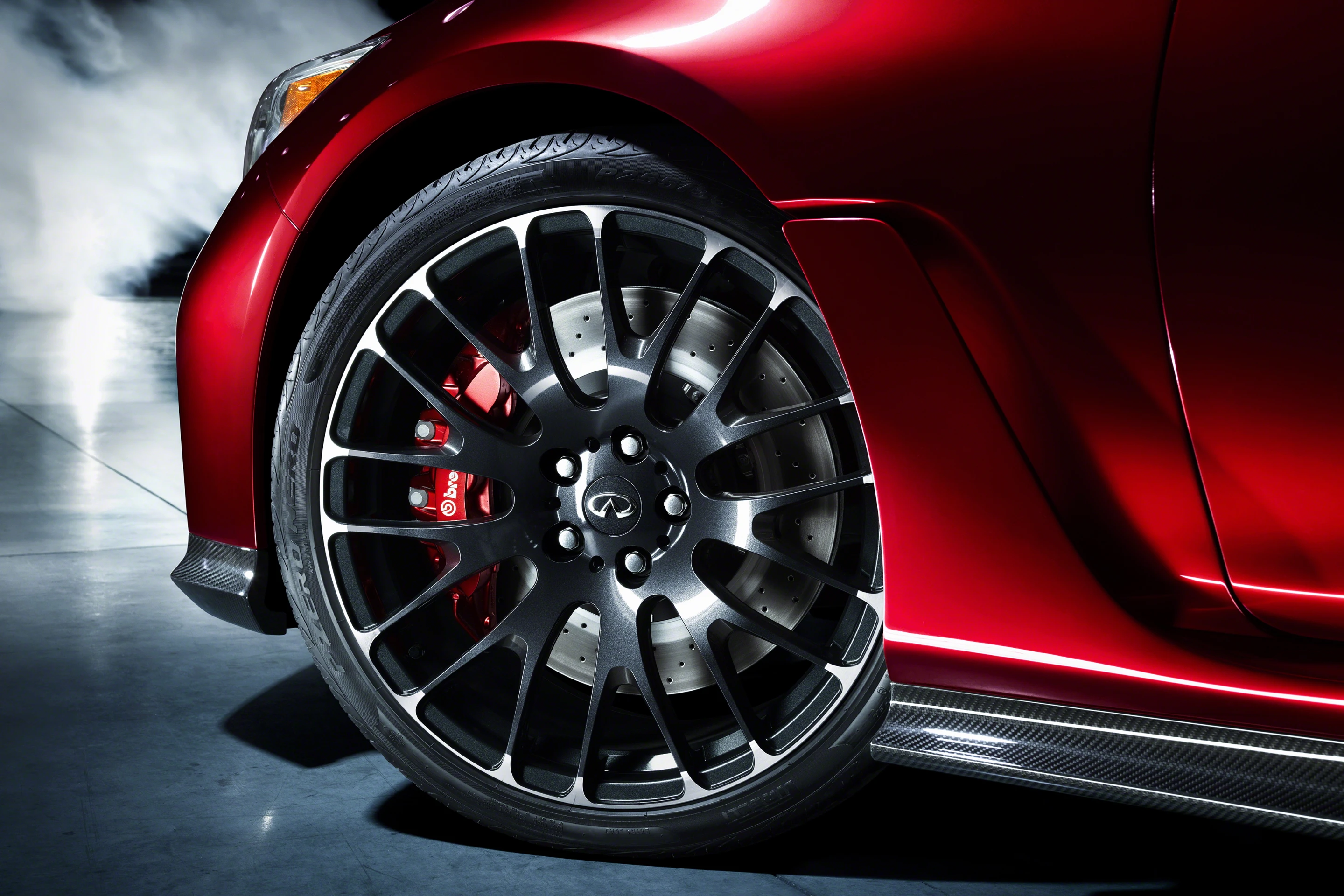 Carbon fiber sculpted aero-sections run the distance between the flared arches and 21 inch forged wheels