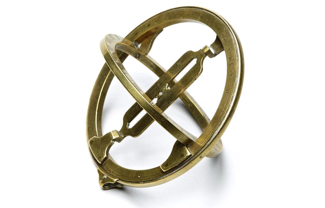 A universal equinoctial ring dial is a portable version of an armillary sundial and was invented around 1600, becoming common throughout Europe. Align the dial towards true North, suspend it from a chord through the moveable suspension point on the vertical meridian ring to match the local latitude, and the sun's rays shine through the slit in the central bar to fall on the hour-lines of the horizontal equatorial ring. Crafted and signed by George Adams in Londonin the third quarter of the 18th century, Adams was appointed as instrument maker to both the Prince of Wales and George III, and mathematical instruments maker to the Office of Ordanance.