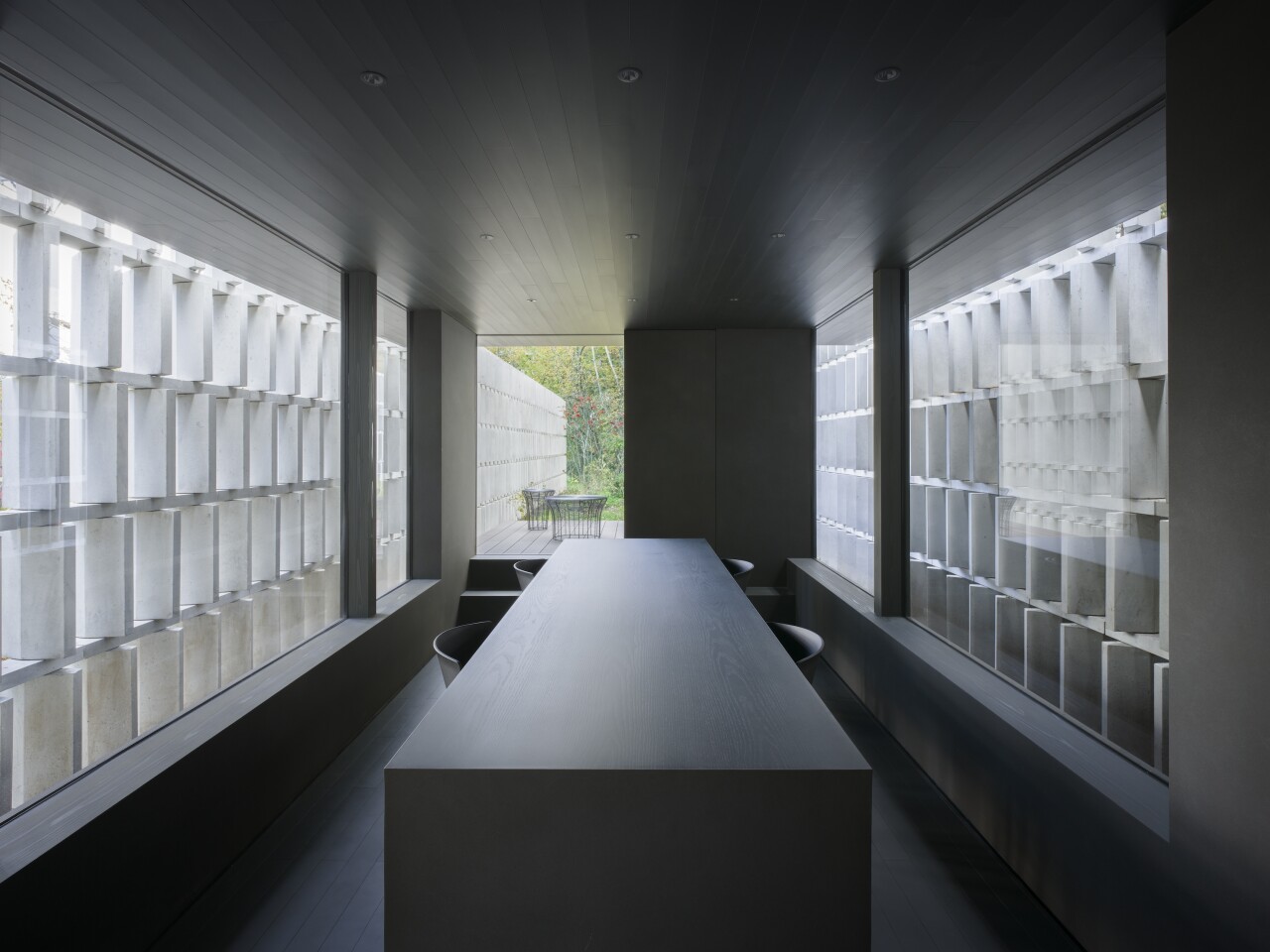 The Block-Wall House's screen is made up of approximately 2,000 blocks staggered in parallel rows