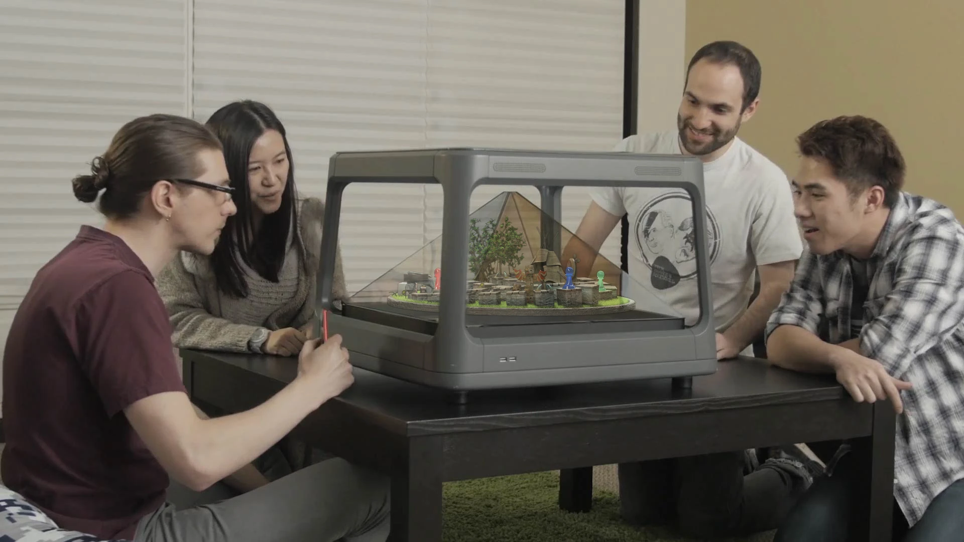 Holus projects 2D images onto the surfaces of a pyramid to produce the illusion of three-dimensional objects and worlds that you can interact with and look at from multiple angles