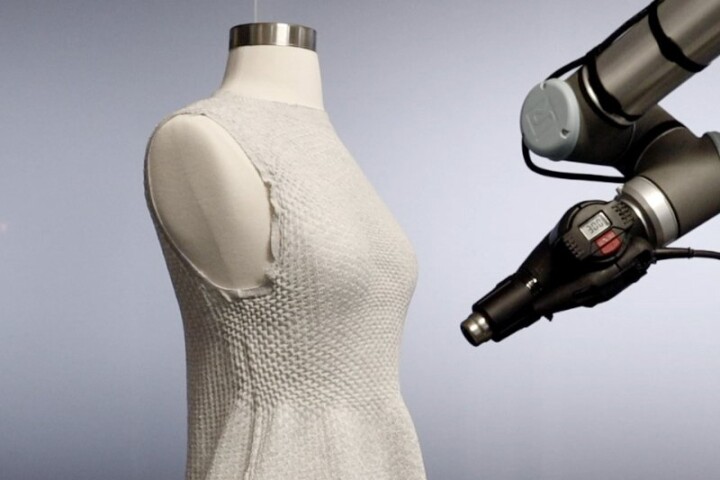 The active yarn in a 4D Knit Dress is shrunk just-so by a robot with a heat gun