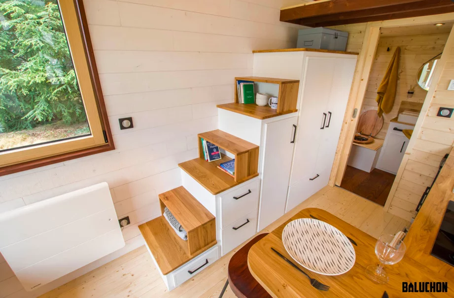 The Piccola Casa's bedroom is reached by storage-integrated staircase