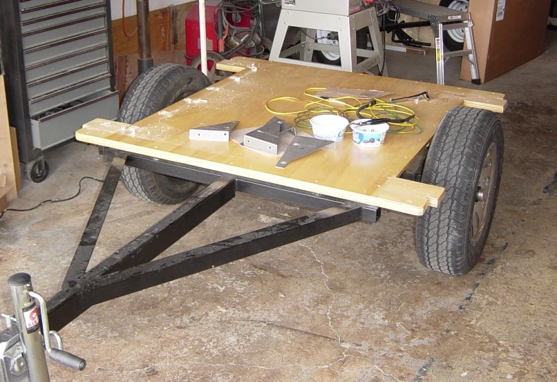 The customer builds a plywood floor over top the frame and then bolts the Dinoot fiberglass tub to it