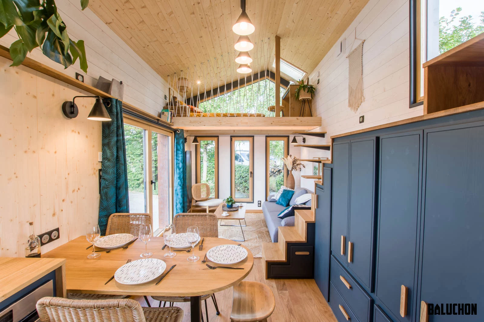 The Gaïa Tiny House's kitchen includes a dining table for up to four people