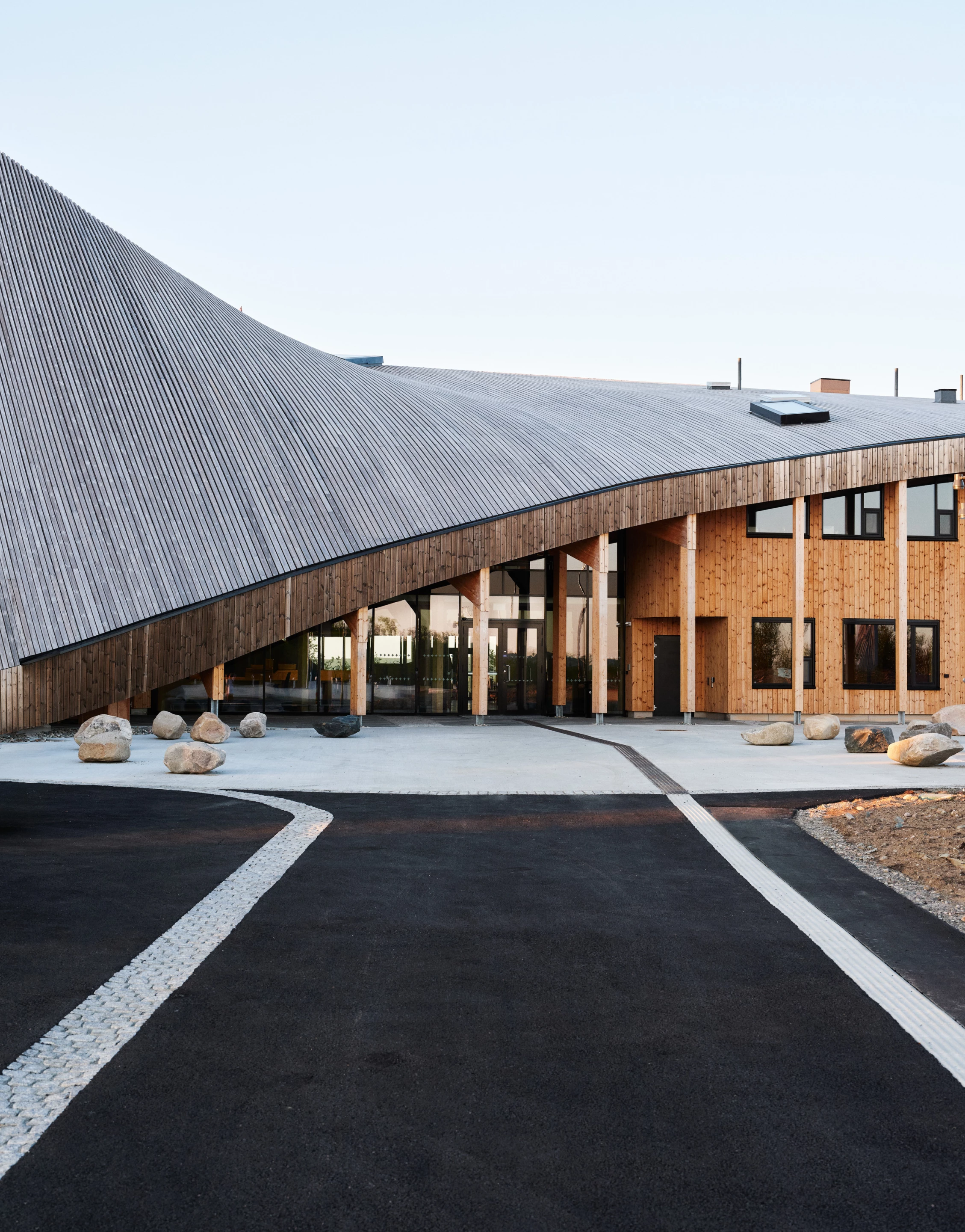 Čoarvemátta's large sloping roof helps to shelter its entrance