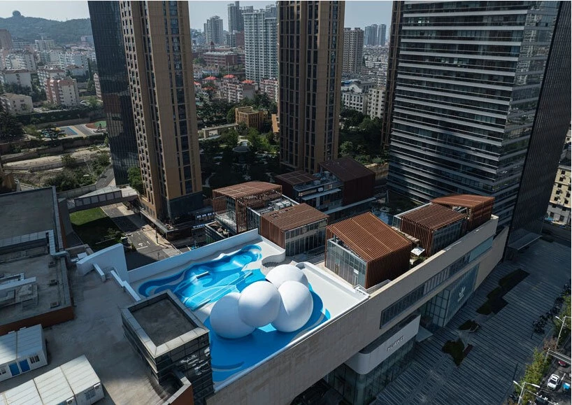 The skatepark's placement on a commercial rooftop terrace challenges traditional retail designs