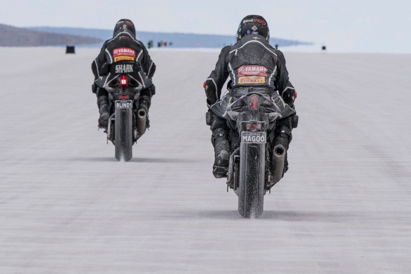 Ex-MotoGP racer Kevin Magee rides behind Felten as he sets the record in 2017