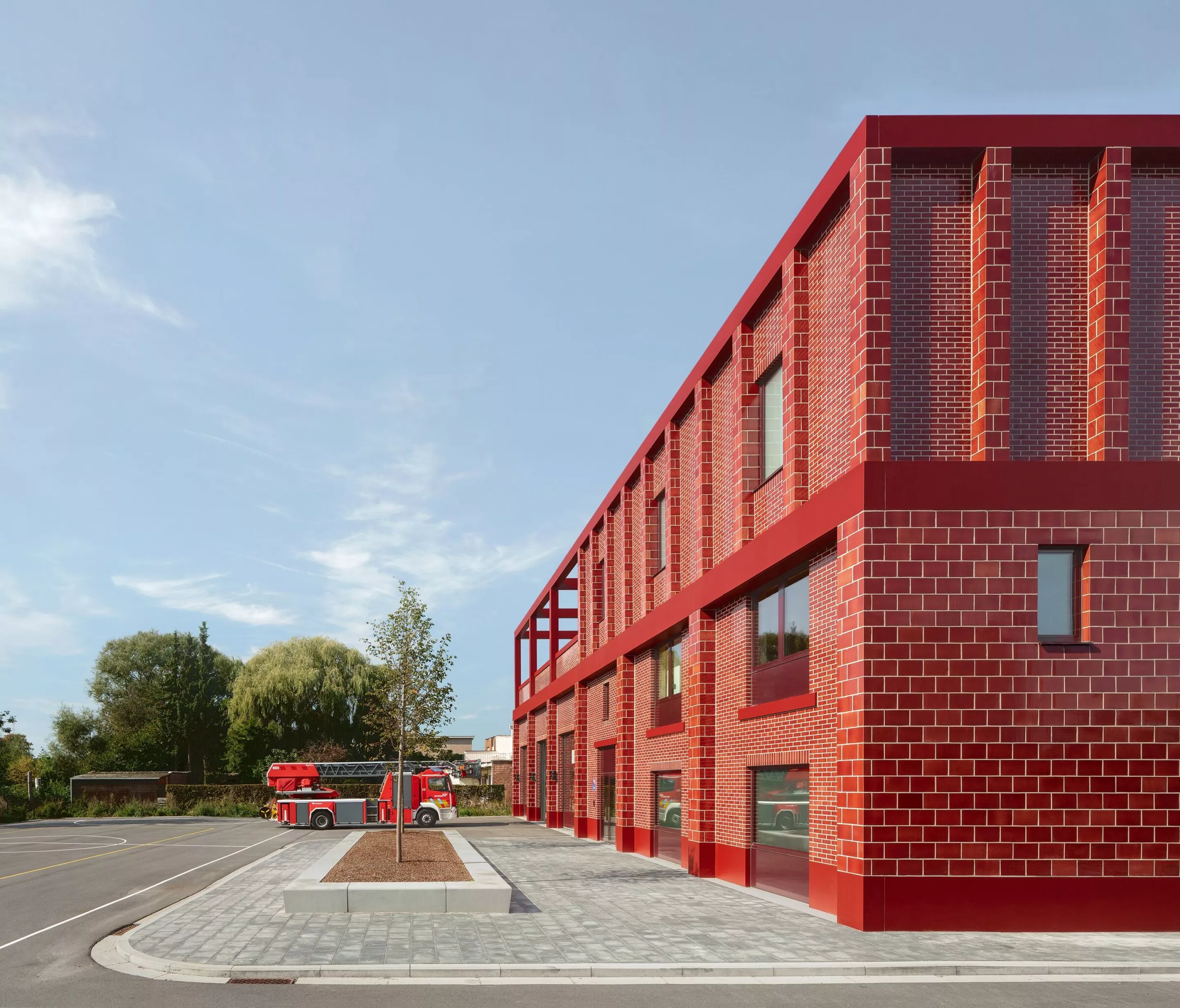 Striking red fire station saves energy, and lives