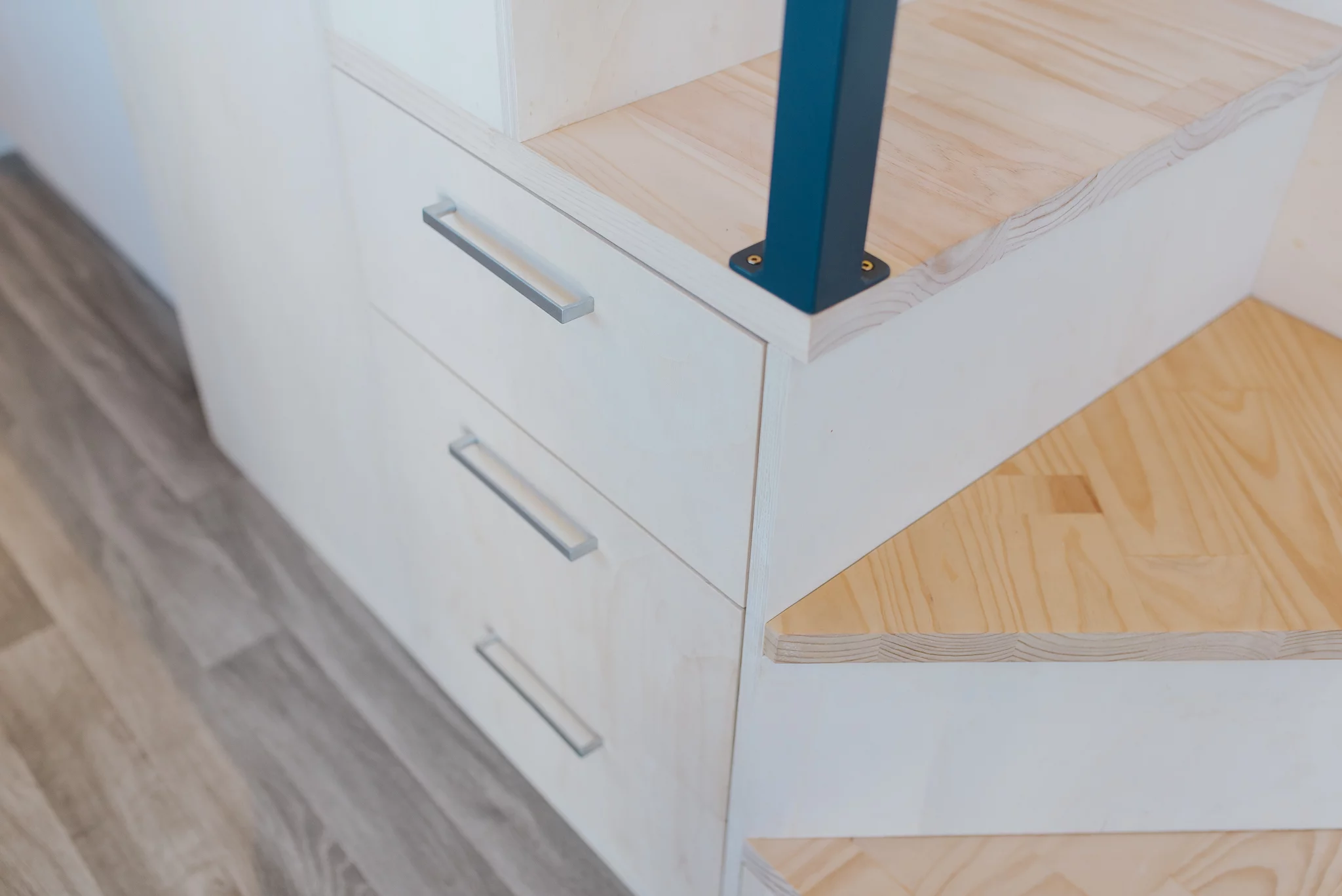 The Purple Palace has one bedroom, which is reached by storage-integrated staircase