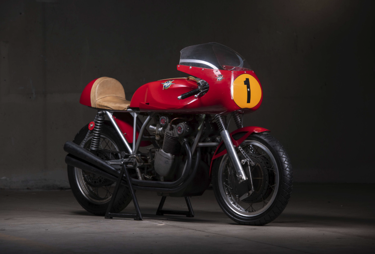 1972 MV Agusta 750 S John Surtees Tribute | Perhaps the most interesting of the six MV Agusta 750 S bikes available at Retromobile this year is this John Surtees tribute bike which is based on a 750 S motor and frame, and is believed to have been one of five constructed by legendary MV Agusta race engineer Arturo Magni. It incorporates Magni's proprietary chain drive conversion, a 300 mm Fontana drum brake, 48 mm Marzocchi forks and four Dell'Orto SSI 29 carburetors. It is no longer a road bike, as all lights and registration requirements have been removed in the construction, but is still estimated to fetch close to the current record auction price for a 750 S at €75,000 to €120,000.