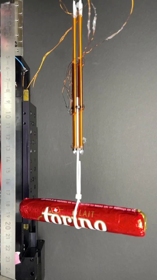 Four bundled FiberMotors lift a chocolate bar