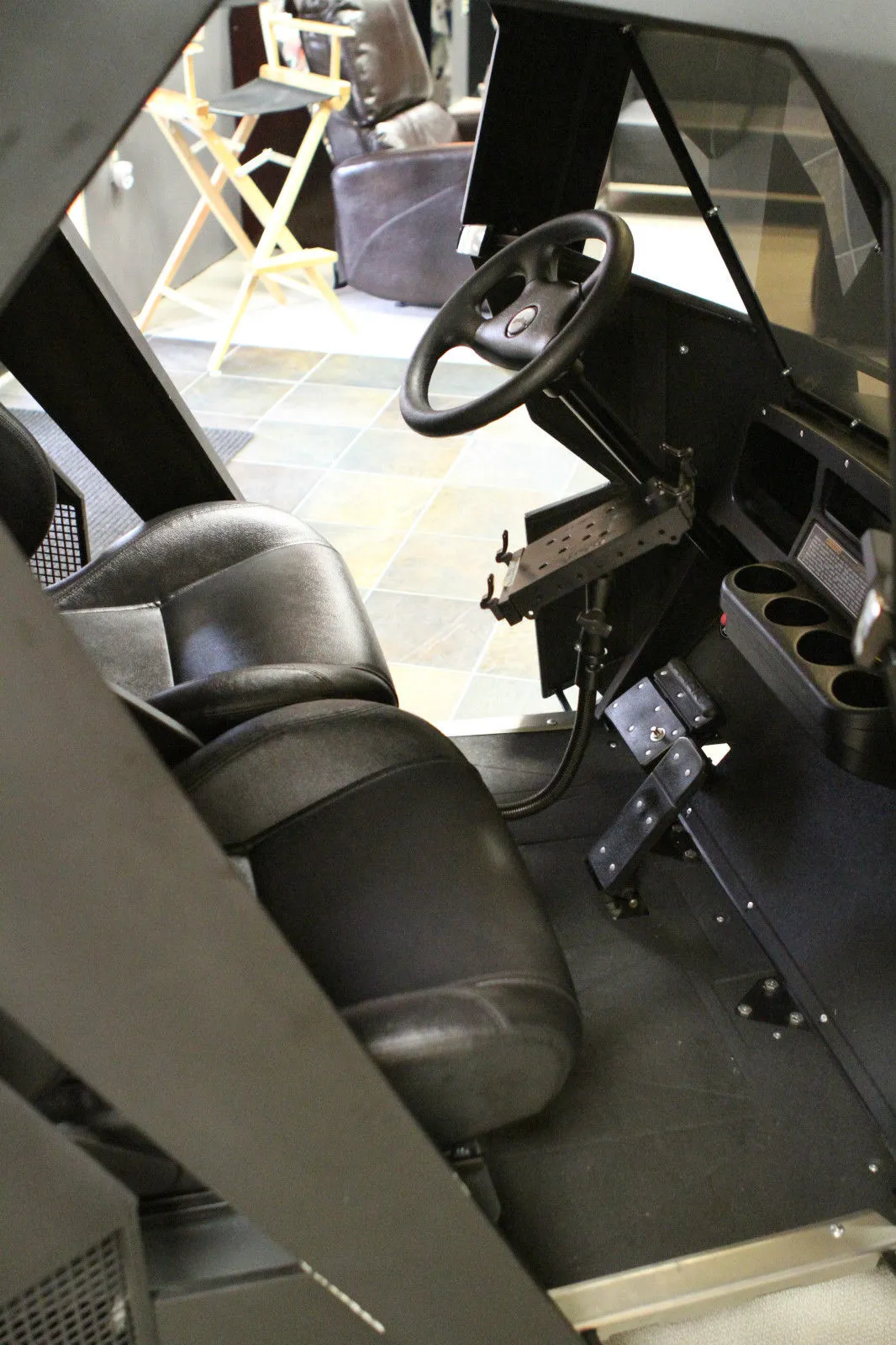Batman cart has adjustable leather seats, four cup holders, iPad with stand, secret kill switch and a Batman logo on the sports steering column