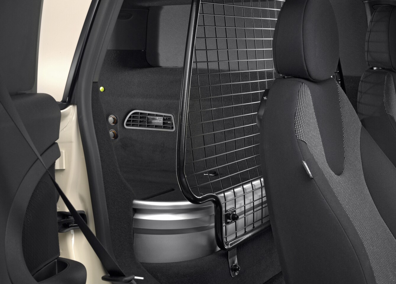 The Mini Clubvan features a partition with stainless steel mesh upper section