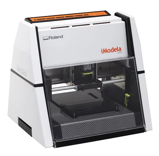 Rather than slowly building a model by layering the material, the iModela iM-01 3D Modeling Machine carves its creations down from a larger block of material