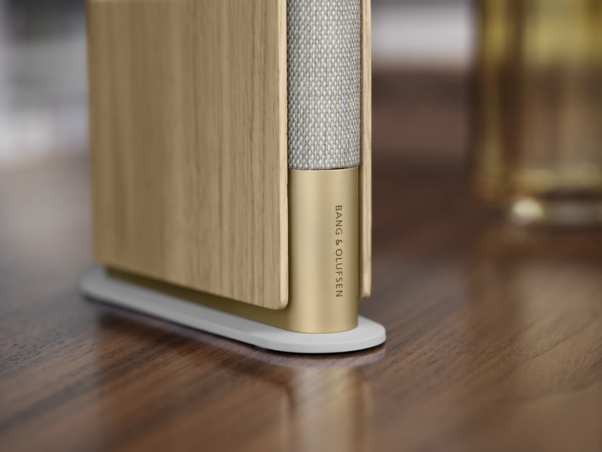 The Beosound Emerge features hard-cover-like side panels and a company logo that resembles the author name on a book spine