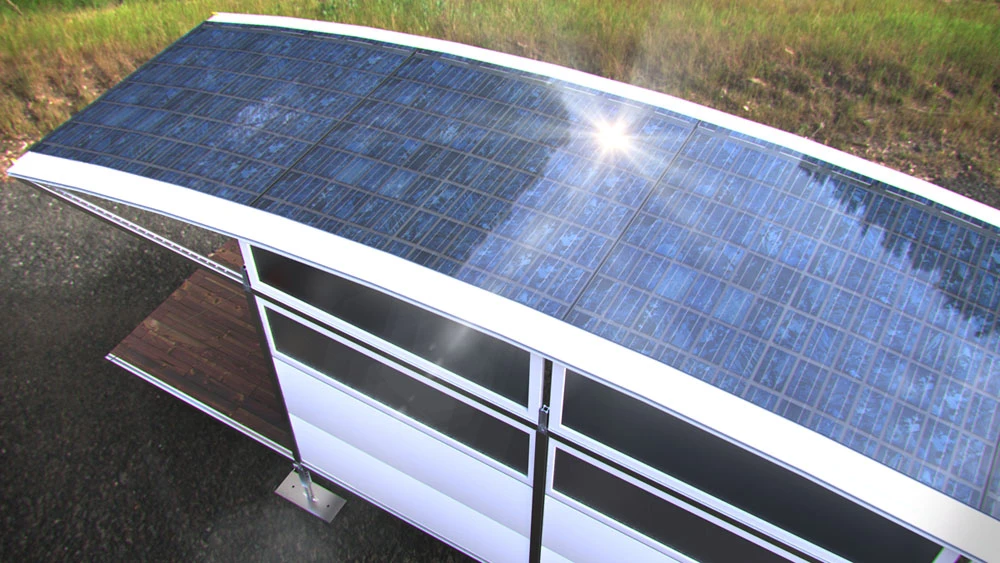 The structure features a large arched roof with integrated solar panels for an off-the-grid power supply