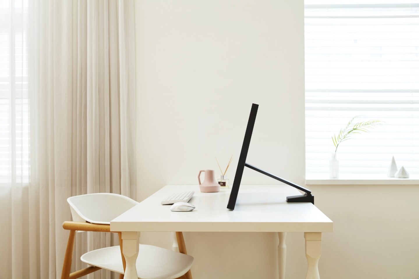 Samsung's Space Monitor is set on a moveable arm that allows the monitor to be angled as needed