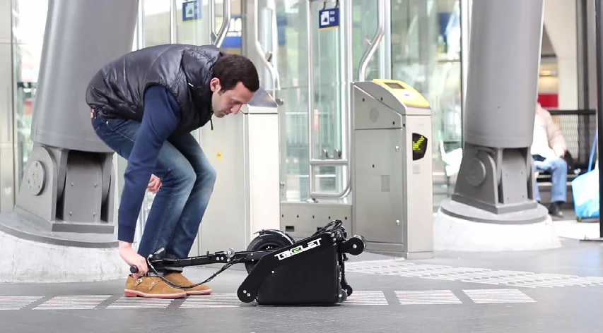 The stand-up steering post also doubles as the scooter's pulling device when transporting about train stations