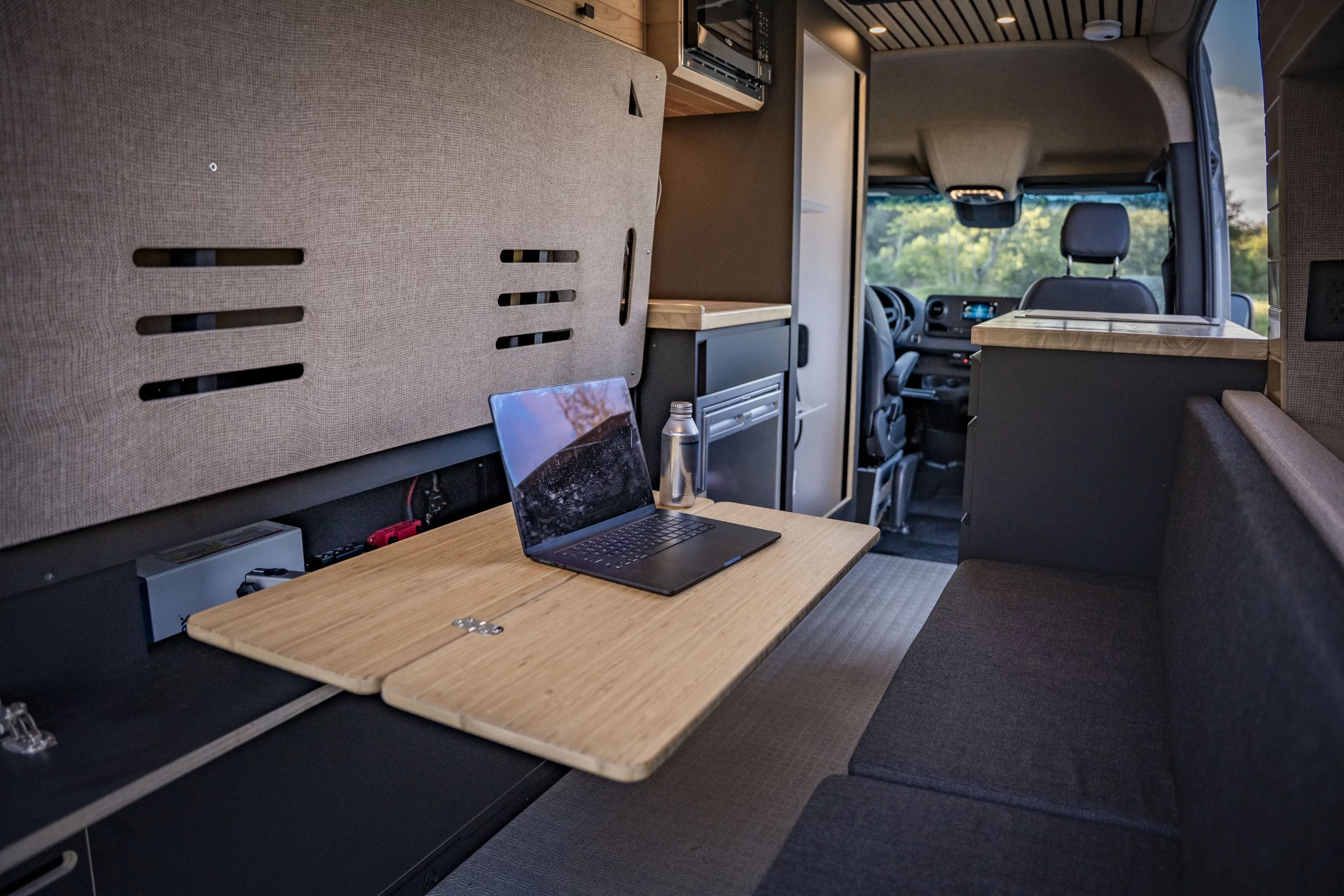 The multipurpose rear lounge looks perfect for digital nomads who can log in from their laptop and enjoy meals there