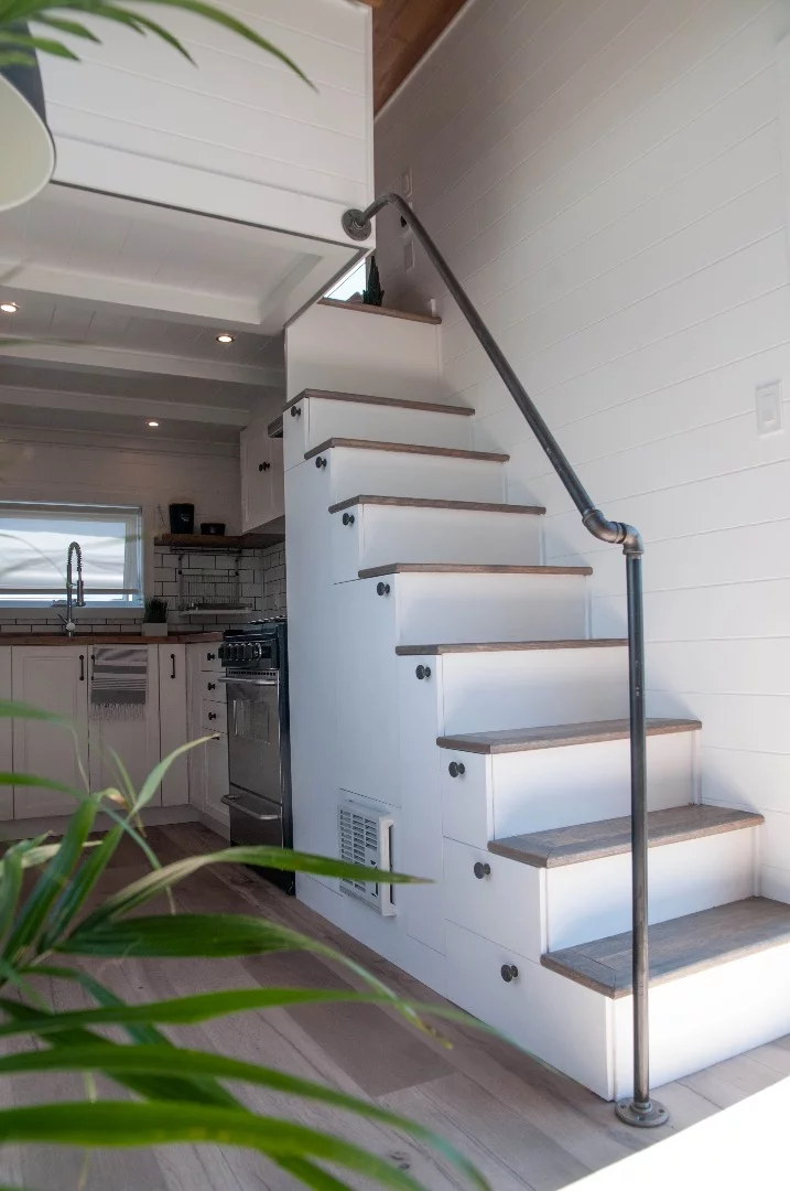 A storage-integrated staircase leads to the Eucalyptus' master bedroom