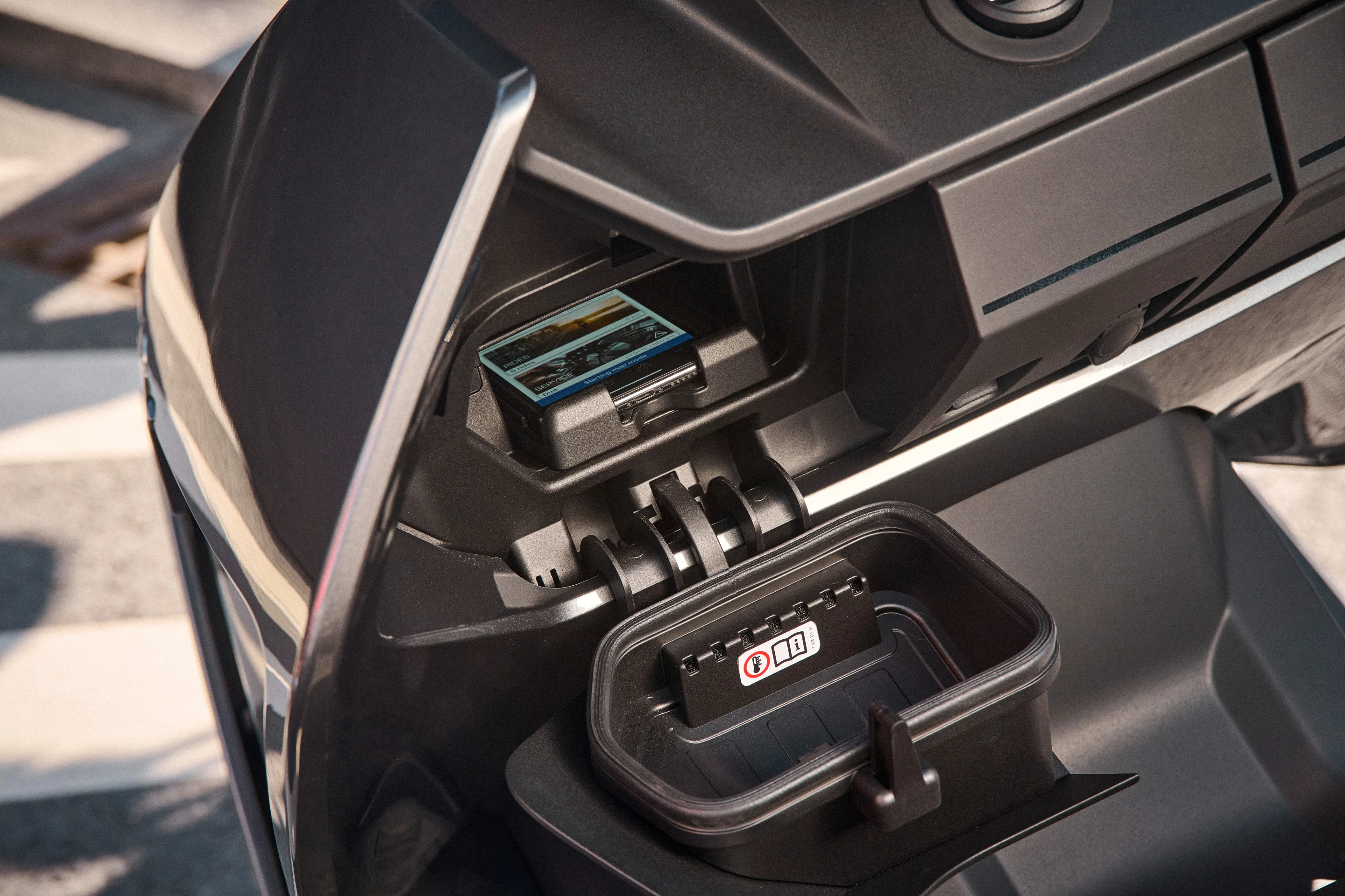 One of the compartments is designed to accommodate a rider's smartphone, with USB-C charging available