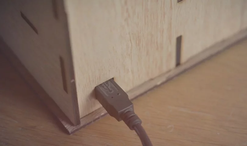The Super Mega Mega Toaster is connected to a computer via a USB cable