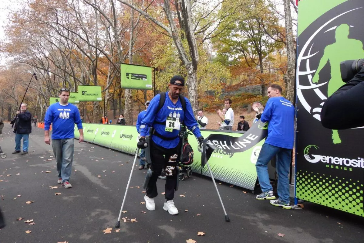"ReWalker" Gene Laureano crosses the finish line at the Generosity NYC 5K