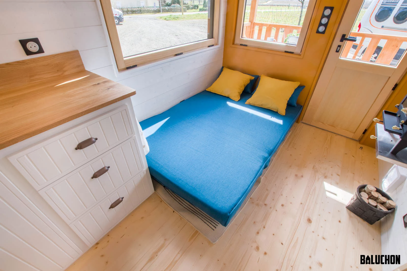 The Miss Twain Tiny House's sofa, shown in the bed position