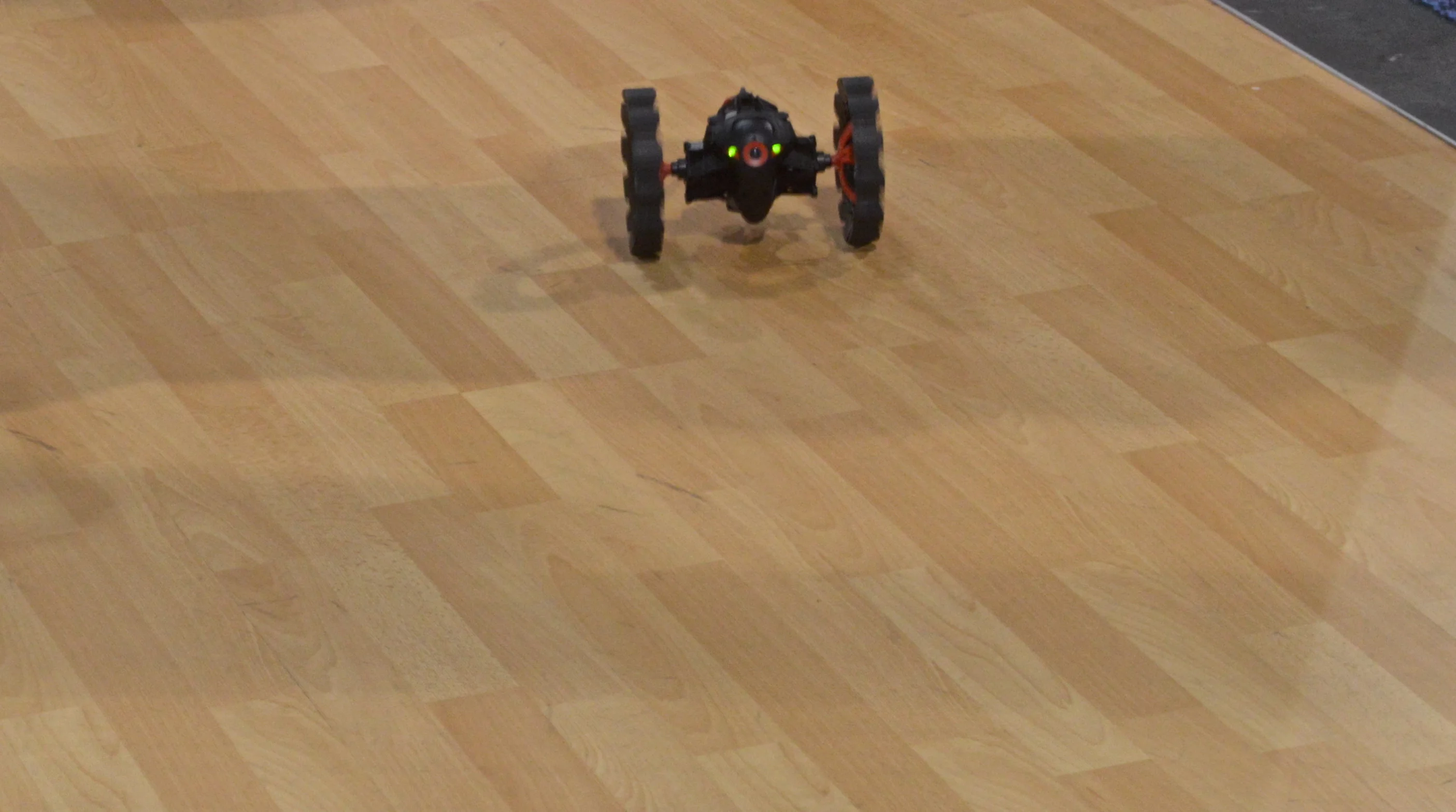 The all-terrain Minidrone explores the floor of Parrot's booth (Photo: C.C. Weiss/Gizmag)