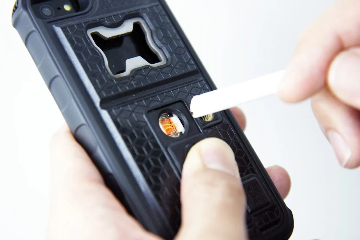 The metal coil lighter provides enough heat to light a candle, paper or cigarette without harming the phone