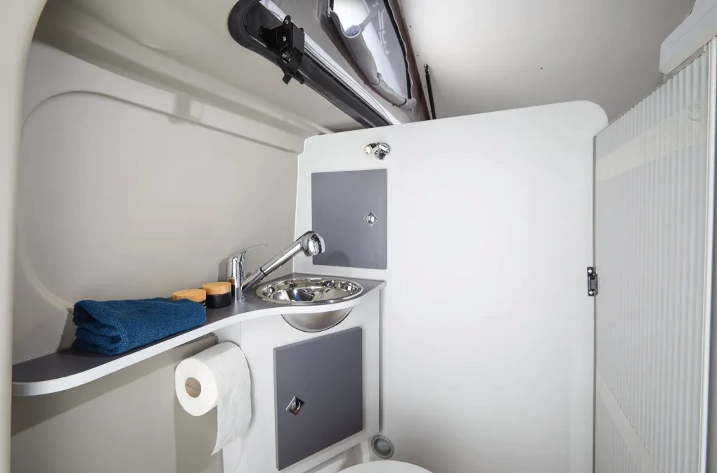 The wall's a bit short due to the pop-up roof, but the Van Big City bathroom is a little more of a private, dedicated space than some other bathrooms in similarly sized camper vans