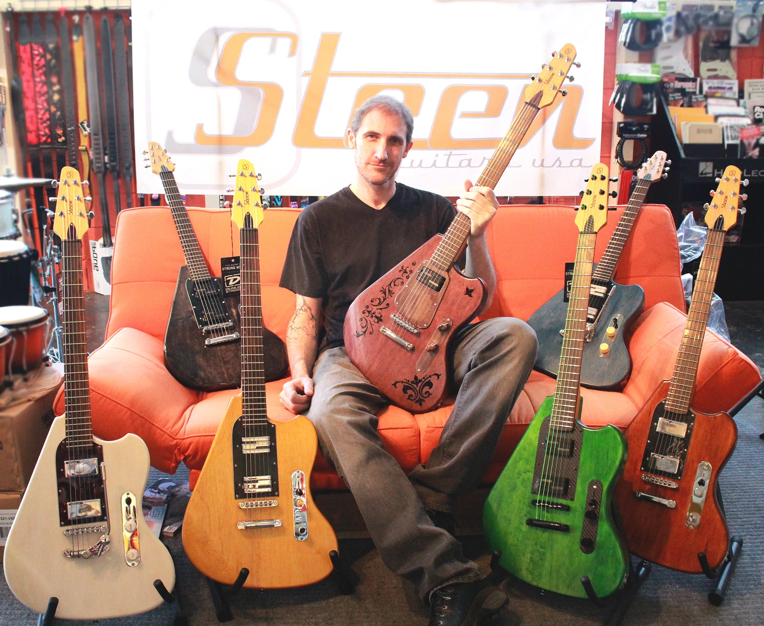 Shawn Steen with his ergonomically-designed guitars