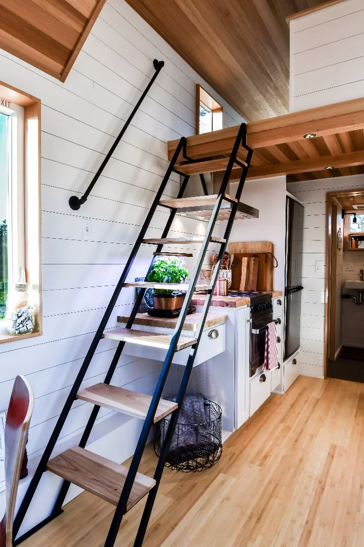 The Urban Payette with Elevator Bed has a roomy main sleeping loft, accessed by these steps