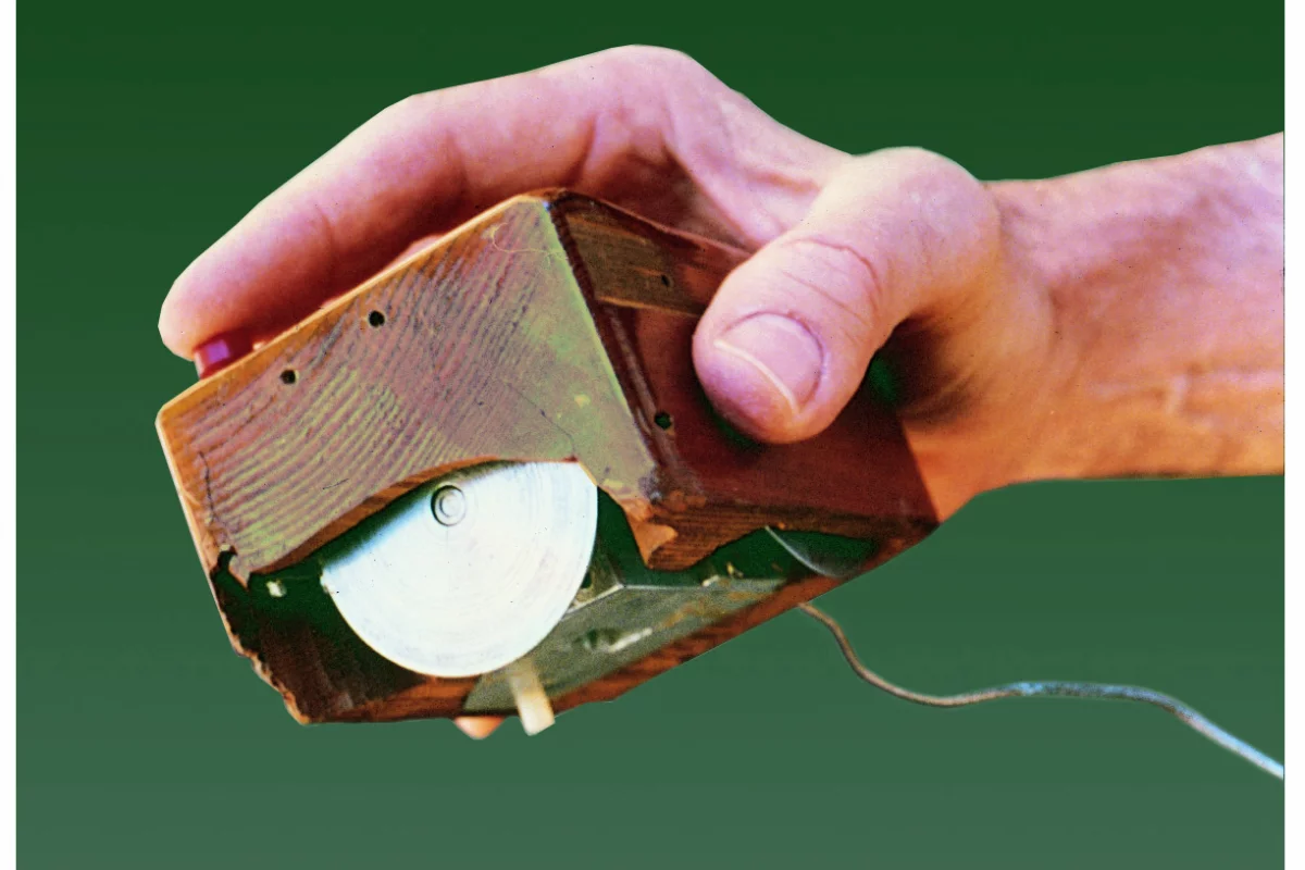 The first computer mouse was made of wood and featured two wheels to control X and Y movement (Image: SRI International)