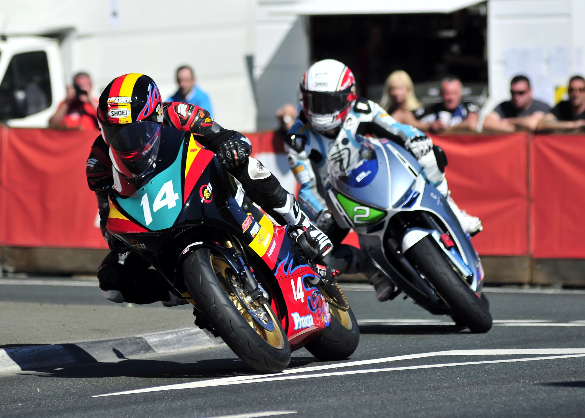 Team Prozza's Yoshinari Matsushita and Team Motoczysz' Mark Miller during practice for the 2011 IOM TT Zero race