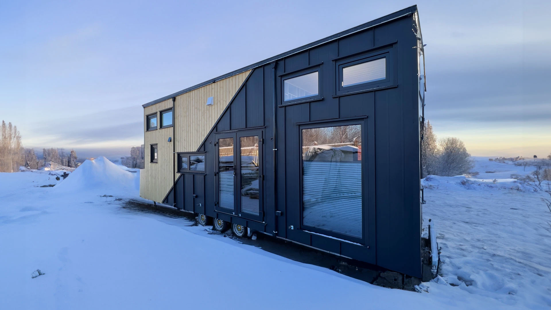 The Mobi Individual Baobab's exterior is finished in sheet metal, with spruce accenting